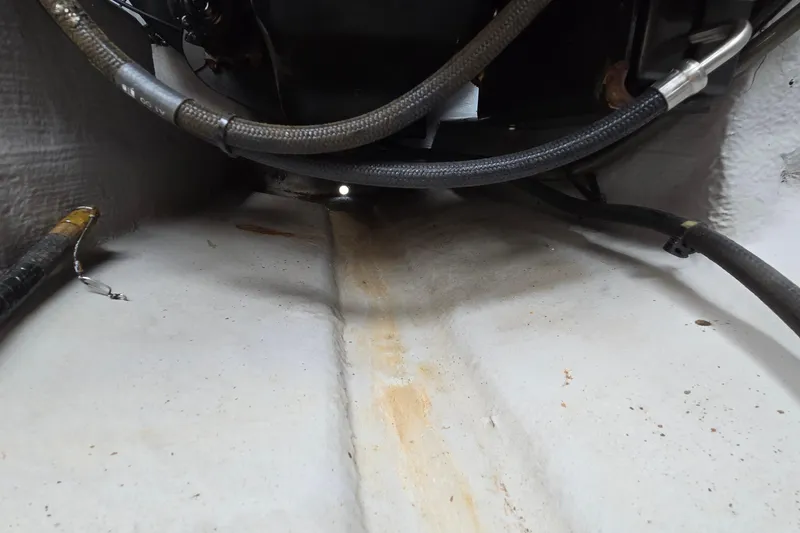 Slide: The Image of 2001 Chaparral Sunesta 233 engine compartment with visible hoses and wiring. - 51