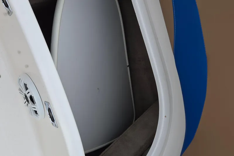 Slide: The Image of 2001 Chaparral Sunesta 233 boat interior with speaker and blue seat detail. - 59