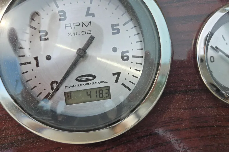 Slide: The Image of Close-up of a 2001 Chaparral Sunesta 233 RPM gauge displaying 418.3 hours. - 65