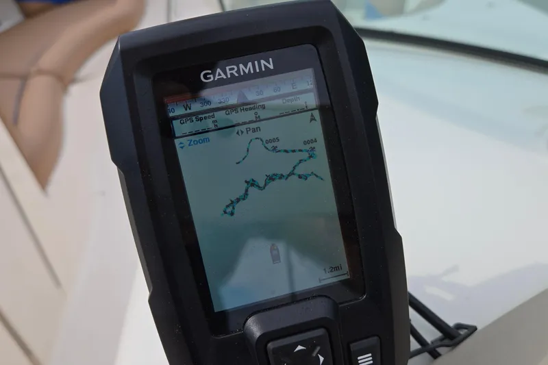 Slide: The Image of Garmin GPS device on 2001 Chaparral Sunesta 233 boat, displaying navigation map. - 67