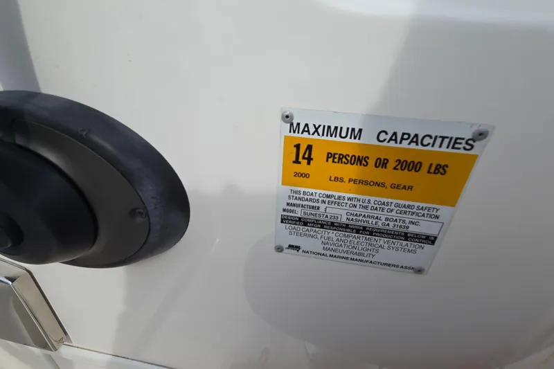 Slide: The Image of 2001 Chaparral Sunesta 233 capacity label, maximum 14 persons or 2000 lbs. - 70