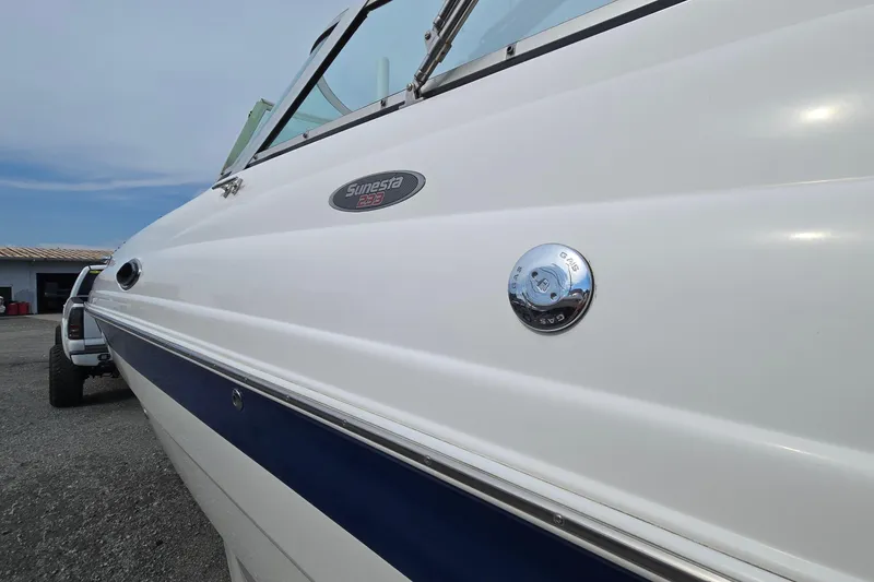 Slide: The Image of 2001 Chaparral Sunesta 233 boat side view with gas cap and logo. - 8