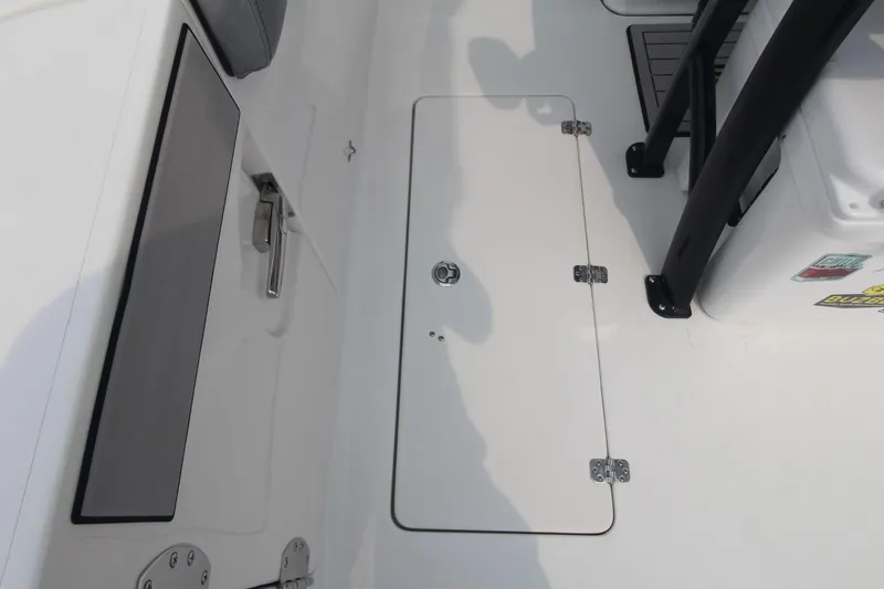Slide: The Image of 2020 Sea Pro 259 Center Console deck with storage hatch and seating area. - 15