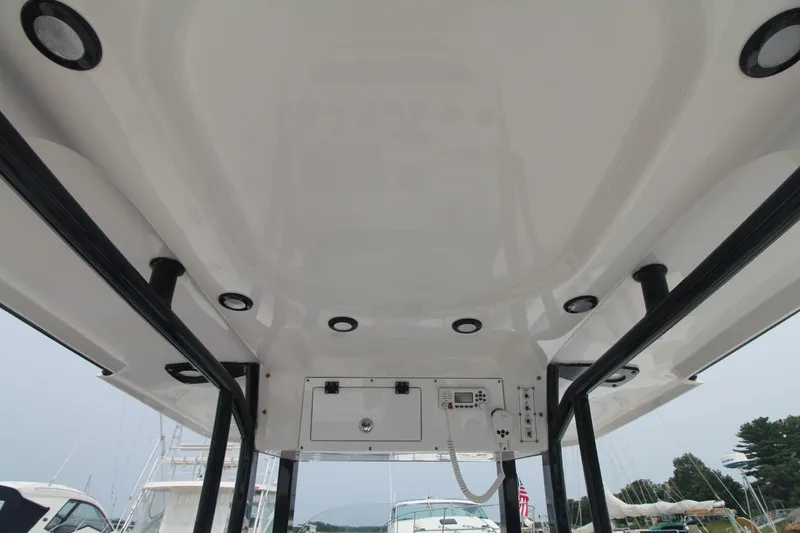 Slide: The Image of 2020 Sea Pro 259 Center Console boat interior with overhead view and lighting. - 21