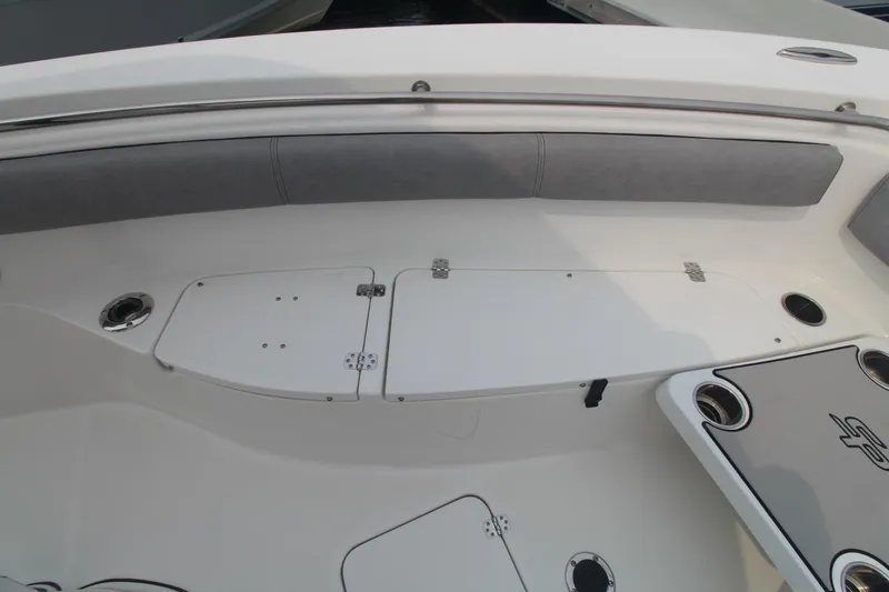 Slide: The Image of 2020 Sea Pro 259 Center Console boat interior with seating and storage compartments. - 25