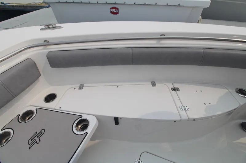 Slide: The Image of 2020 Sea Pro 259 Center Console boat interior with seating and storage compartments. - 26