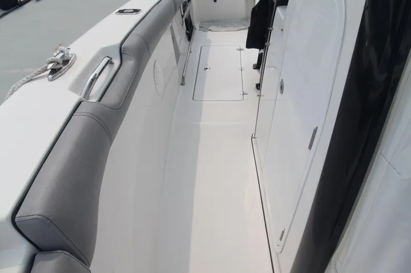 Slide: The Image of 2020 Sea Pro 259 Center Console boat interior with sleek design and cushioned seating. - 29