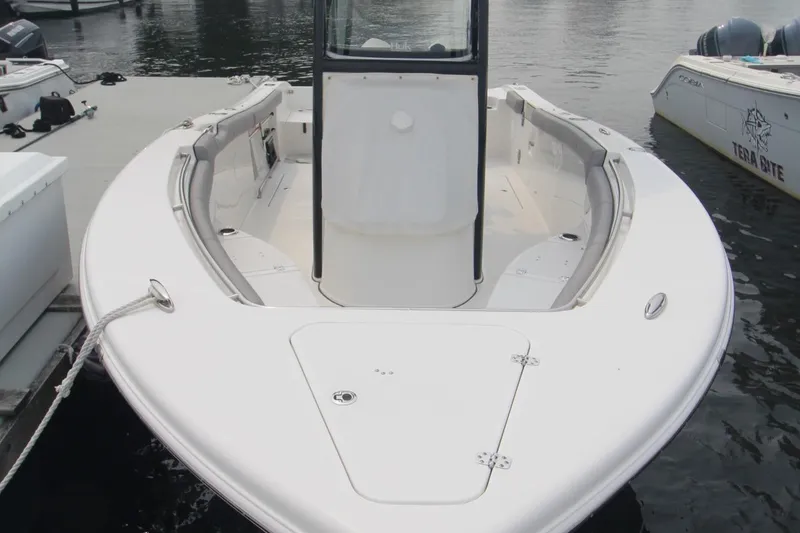 Slide: The Image of 2020 Sea Pro 259 Center Console boat docked at marina. - 3