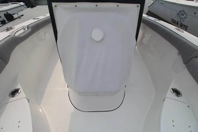 Slide: The Image of 2020 Sea Pro 259 Center Console boat interior with cushioned seating and storage. - 30