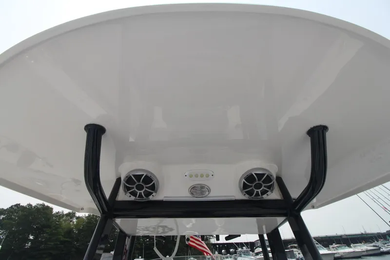 Slide: The Image of 2020 Sea Pro 259 Center Console T-top with speakers and lights, docked at marina. - 31