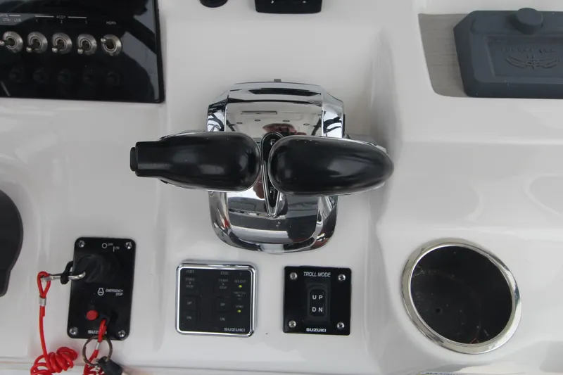 Slide: The Image of Close-up of 2020 Sea Pro 259 Center Console boat controls and throttle. - 38