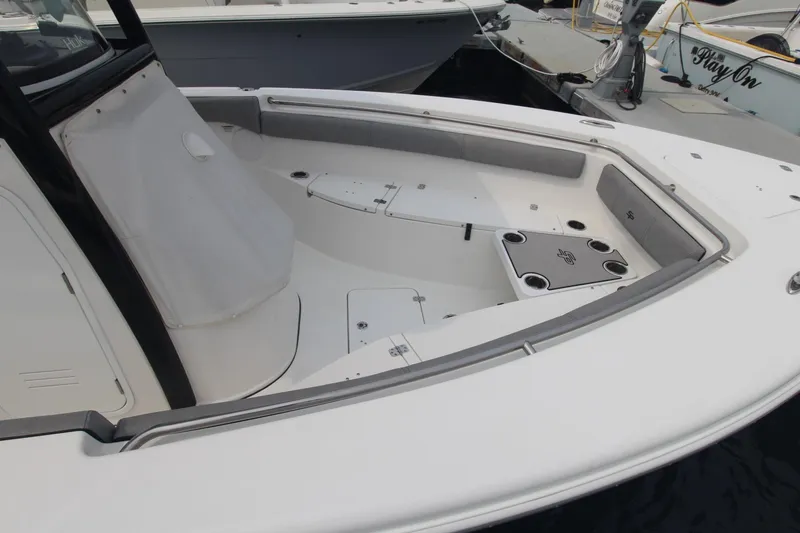 Slide: The Image of 2020 Sea Pro 259 Center Console boat interior with seating and storage compartments. - 4