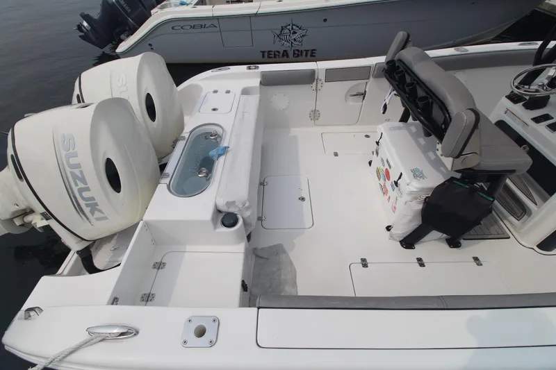 Slide: The Image of 2020 Sea Pro 259 Center Console boat with Suzuki engines, docked and ready. - 8