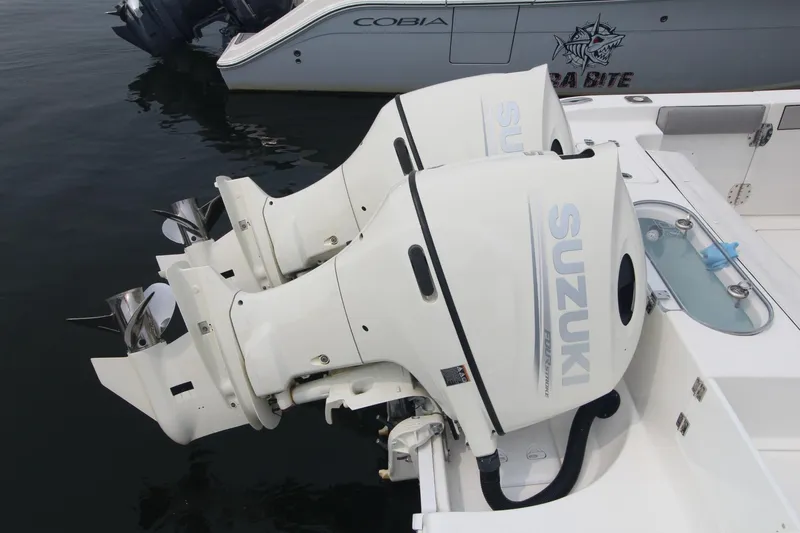 Slide: The Image of Twin Suzuki outboard engines on a 2020 Sea Pro 259 Center Console boat. - 9