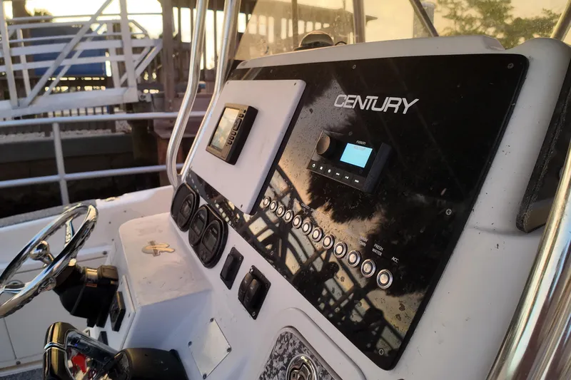 Slide: The Image of Century 2900 Center Console 2004 dashboard with controls and steering wheel. - 10