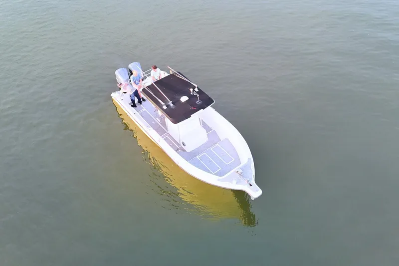 Slide: The Image of Aerial view of 2004 Century 2900 Center Console boat on calm water. - 8
