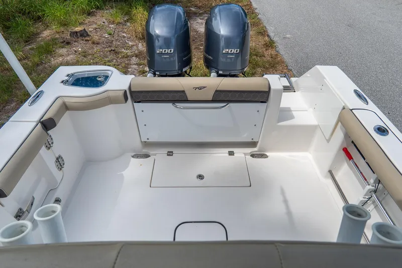 Slide: The Image of 2020 Tidewater 272 CC Adventure boat deck with twin Yamaha 200 engines. - 13