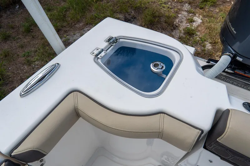 Slide: The Image of 2020 Tidewater 272 CC Adventure boat with seating and storage compartment. - 15