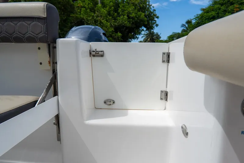 Slide: The Image of 2020 Tidewater 272 CC Adventure boat interior with seating and storage compartment. - 17