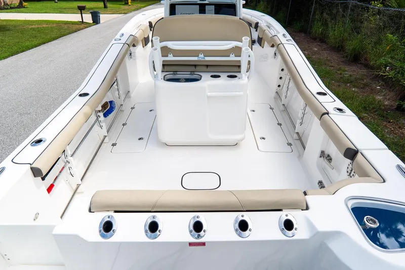 Slide: The Image of 2020 Tidewater 272 CC Adventure boat interior with seating and storage compartments. - 21