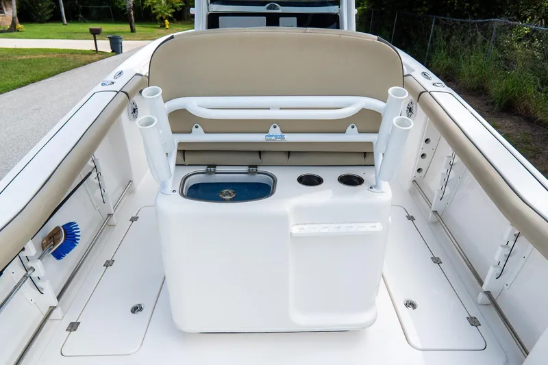 Slide: The Image of 2020 Tidewater 272 CC Adventure boat interior with seating and rod holders. - 22