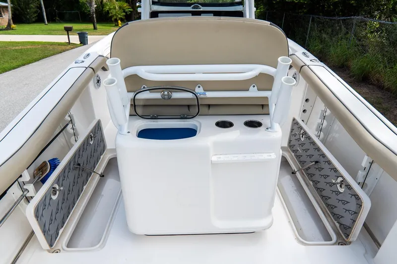 Slide: The Image of 2020 Tidewater 272 CC Adventure boat interior with seating and storage compartments. - 23