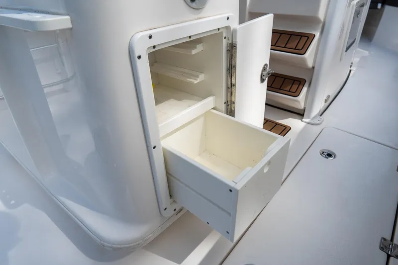 Slide: The Image of Open storage compartment on 2020 Tidewater 272 CC Adventure boat deck. - 34