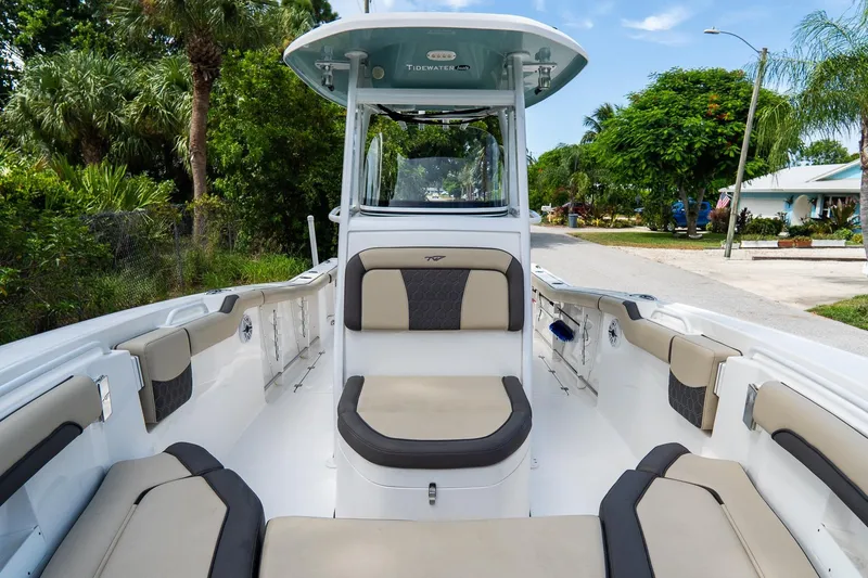 Slide: The Image of 2020 Tidewater 272 CC Adventure boat interior with cushioned seating and sleek design. - 48