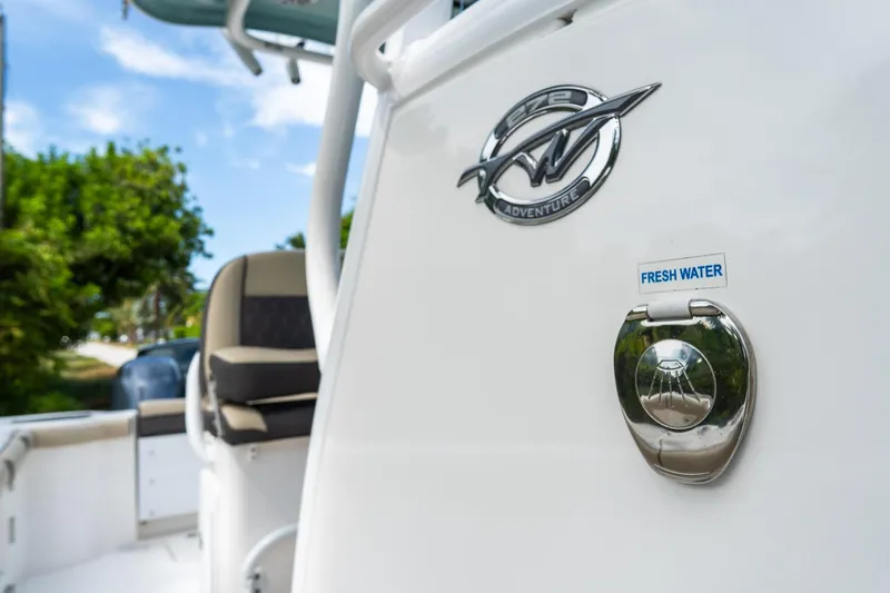 Slide: The Image of 2020 Tidewater 272 CC Adventure boat with fresh water access, close-up view. - 51