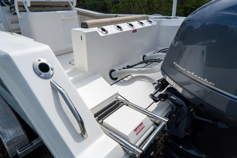 Slide: The Image of 2020 Tidewater 272 CC Adventure boat with four-stroke engine and stainless steel features. - 7