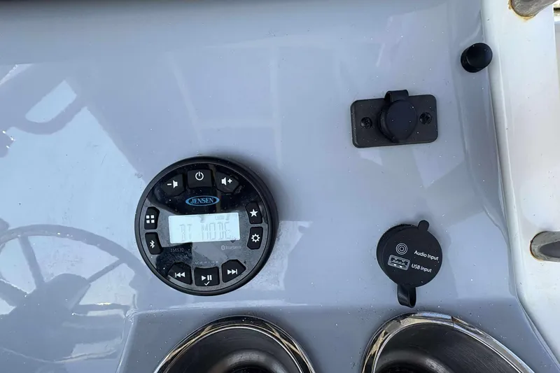 Slide: The Image of 2022 Bayliner Trophy T20CC dashboard with Jensen audio system and USB input. - 25