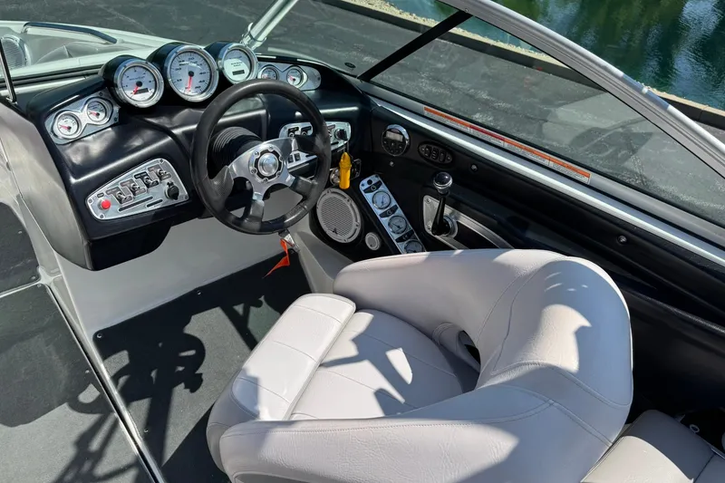 Slide: The Image of 2007 MasterCraft X15 boat interior with steering wheel and control panel. - 10