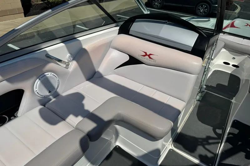 Slide: The Image of 2007 MasterCraft X15 boat interior with white seating and speaker detail. - 11