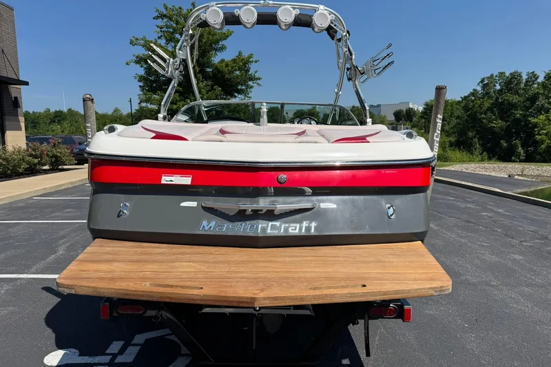 Slide: The Image of 2007 MasterCraft X15 boat with wakeboard tower, parked in a lot, rear view. - 4