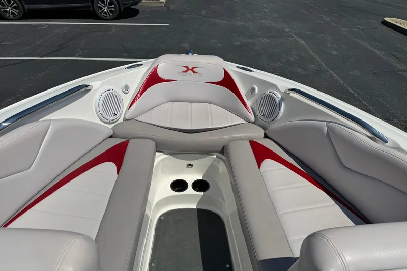 Slide: The Image of 2007 MasterCraft X15 boat interior with red and white seating and speakers. - 9