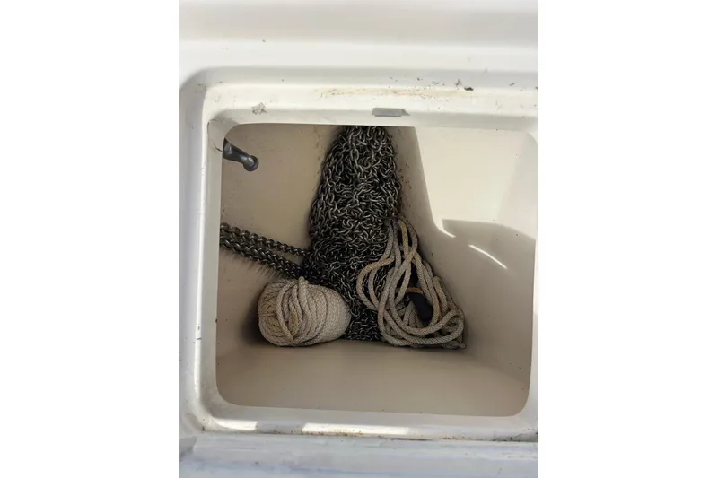 Slide: The Image of Bow of 2008 Mainship Pilot 34 boat with anchor and chain on deck. - 105