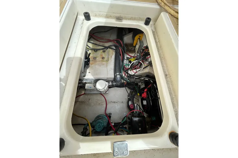 Slide: The Image of Engine compartment of 2008 Mainship Pilot 34 with wiring and components visible. - 18