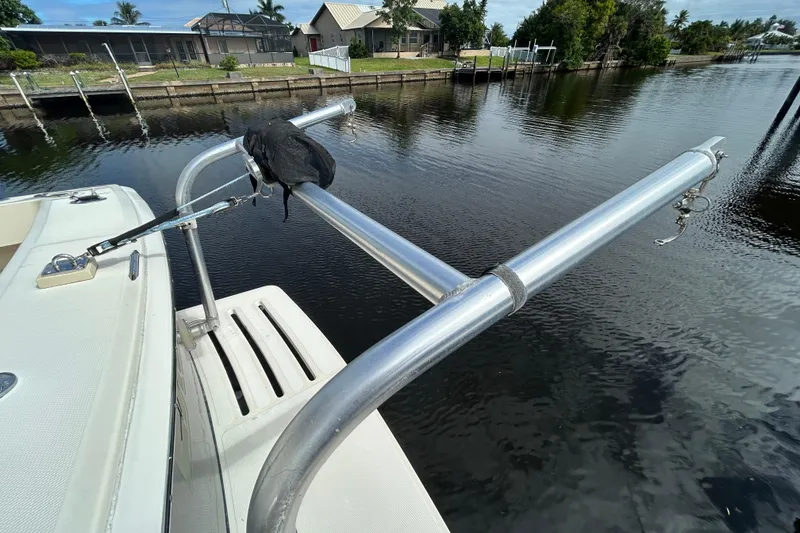 Slide: The Image of 2008 Mainship Pilot 34 docked at marina under clear blue sky. - 20