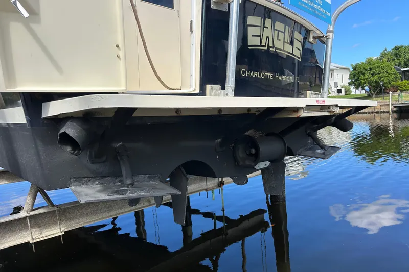 Slide: The Image of 2008 Mainship Pilot 34 interior with kitchen, dining area, and cozy seating. - 35