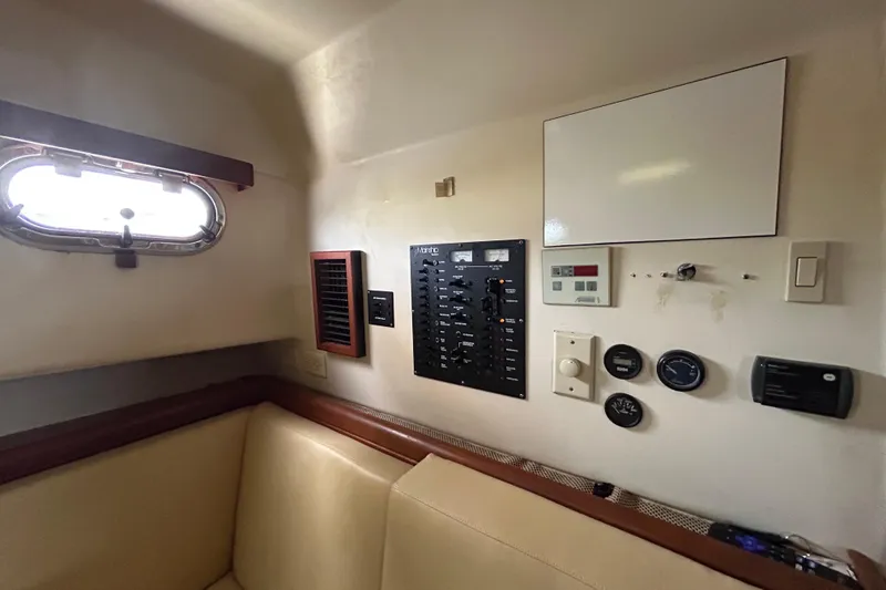 Slide: The Image of 2008 Mainship Pilot 34 interior with control panel and seating area. - 50