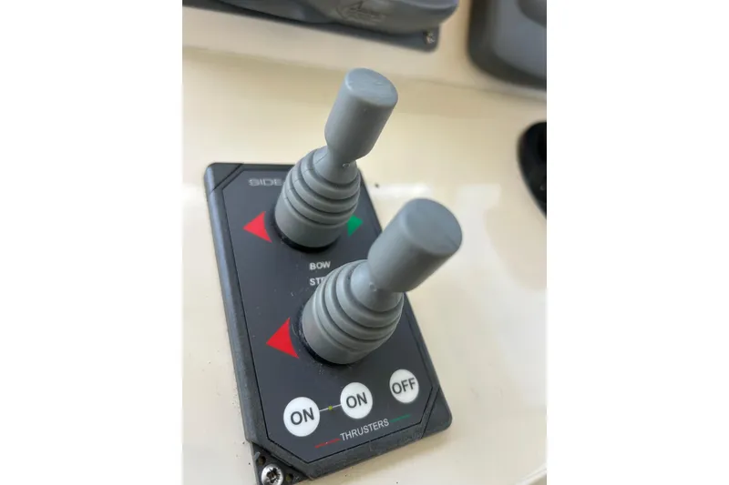 Slide: The Image of Close-up of throttle controls on a 2008 Mainship Pilot 34 boat. - 63