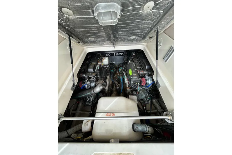 Slide: The Image of 2008 Mainship Pilot 34 engine compartment with open hatch and "Eagle" mat. - 75