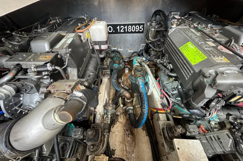 Slide: The Image of Engine compartment of a 2008 Mainship Pilot 34 boat, showcasing mechanical components. - 76