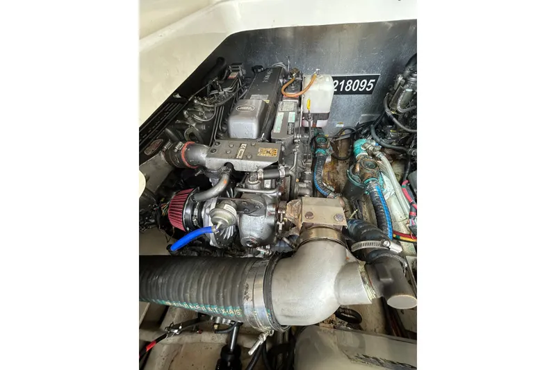 Slide: The Image of Engine of a 2008 Mainship Pilot 34 boat, showcasing mechanical components. - 81