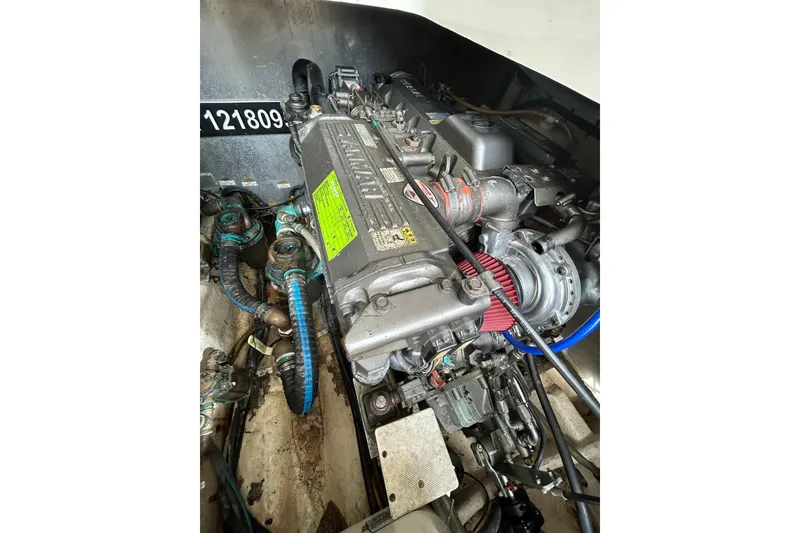 Slide: The Image of Engine compartment of a 2008 Mainship Pilot 34 boat, showcasing mechanical components. - 82