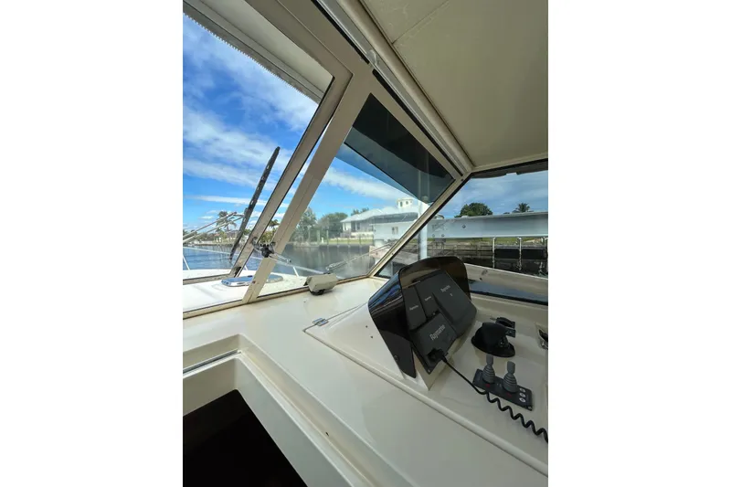 Slide: The Image of Engine compartment of a 2008 Mainship Pilot 34 boat, showcasing mechanical components. - 83