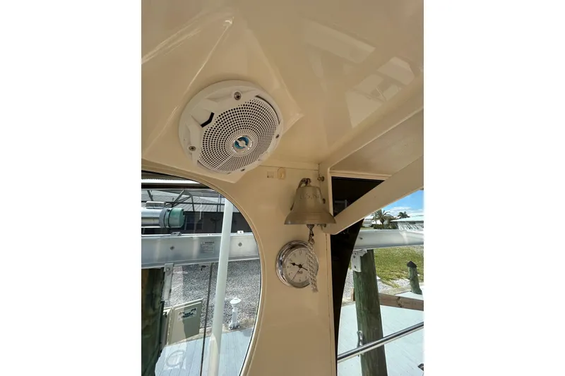 Slide: The Image of 2008 Mainship Pilot 34 helm view with navigation equipment and clear windshield. - 84