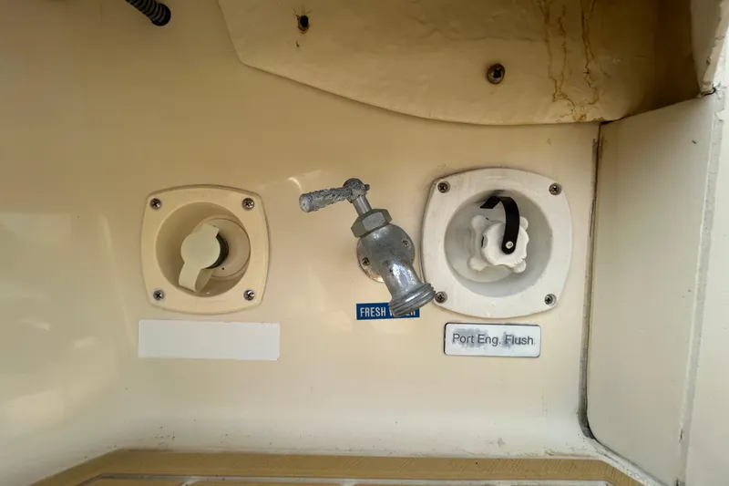 Slide: The Image of 2008 Mainship Pilot 34 boat deck with teak flooring and cabin doors. - 87