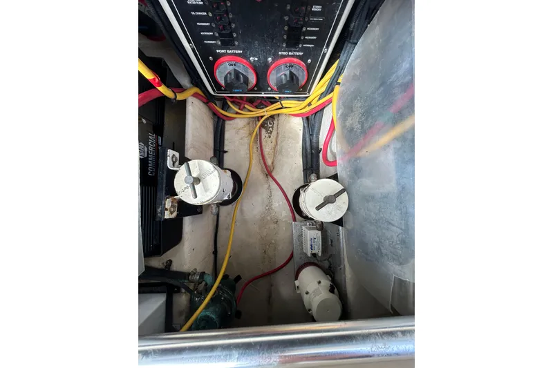 Slide: The Image of 2008 Mainship Pilot 34 engine compartment with visible wiring and components. - 90