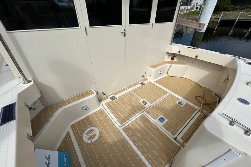 Slide: The Image of 2008 Mainship Pilot 34 engine compartment with wiring and components visible. - 94